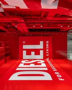 Red room with white logotype covering the floor