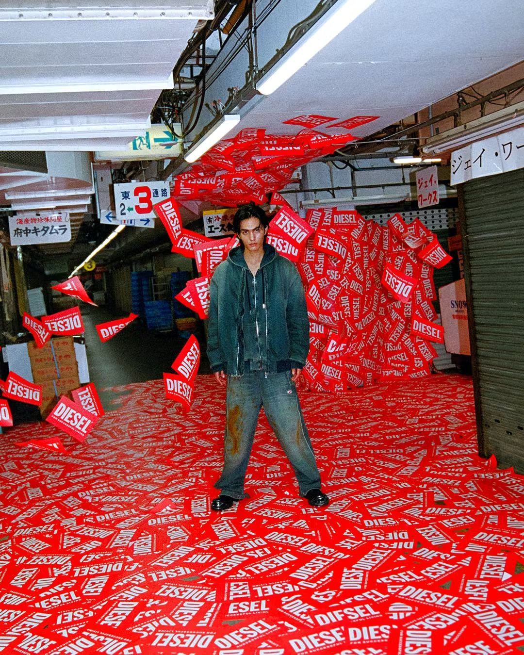 Person standing in a corridor covered in red flyers