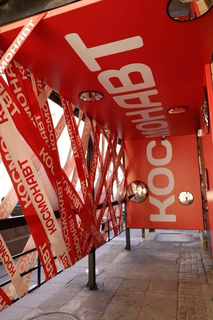Entryway with red and white printed banner tape strung at angles