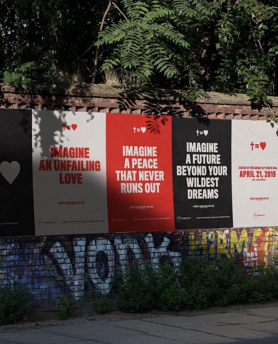 Row of red, white and black posters pasted on an outdoor wall
