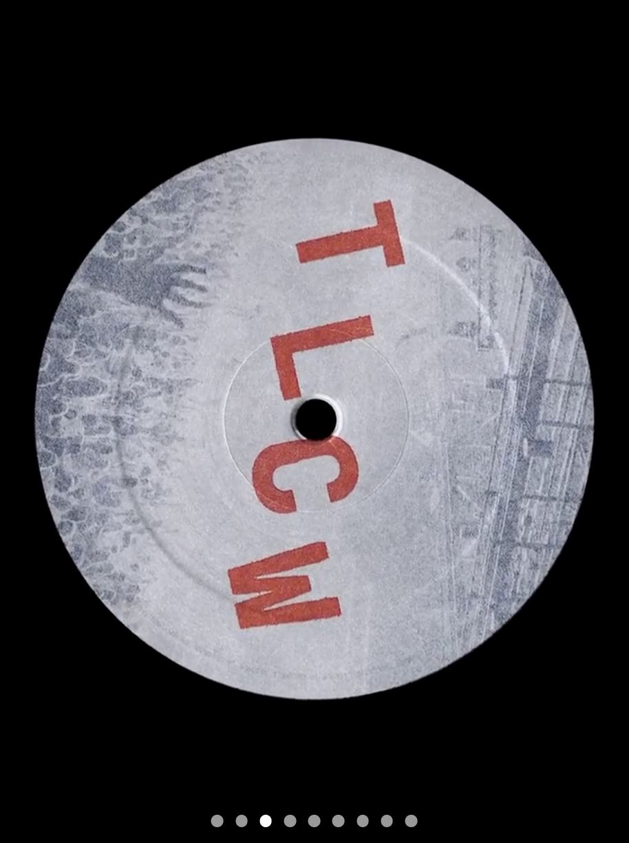 Vinyl record label with red letters on a grey printed ground