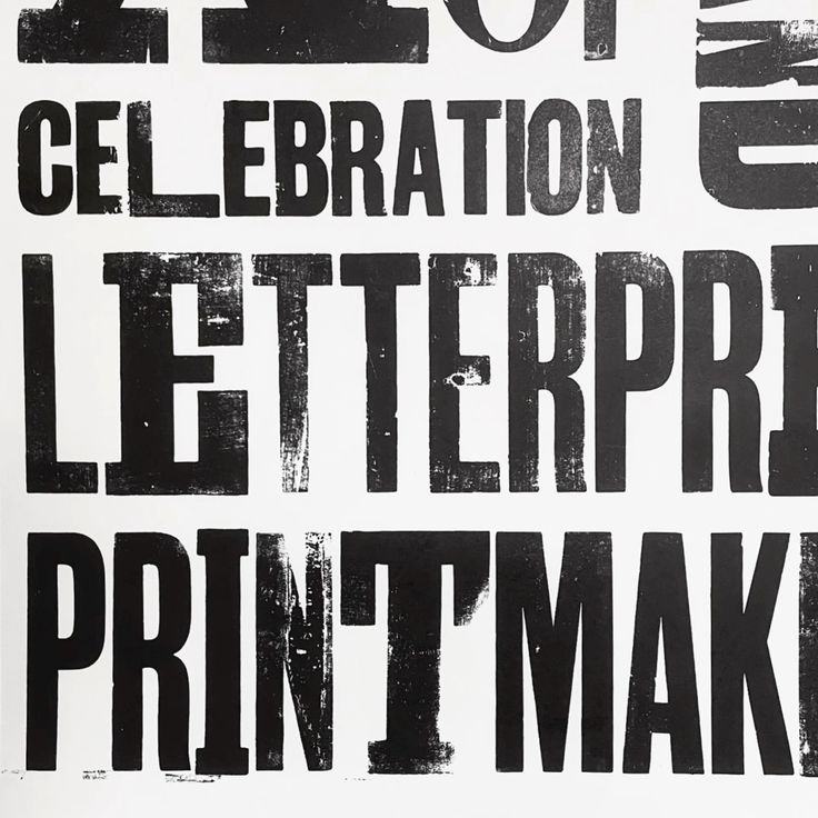 Black woodtype letterpress printing filling the frame